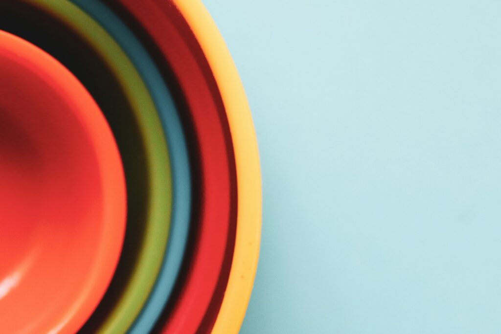 yellow red and blue round plastic toy