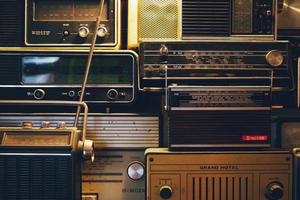 a bunch of old radio's are stacked on top of each other