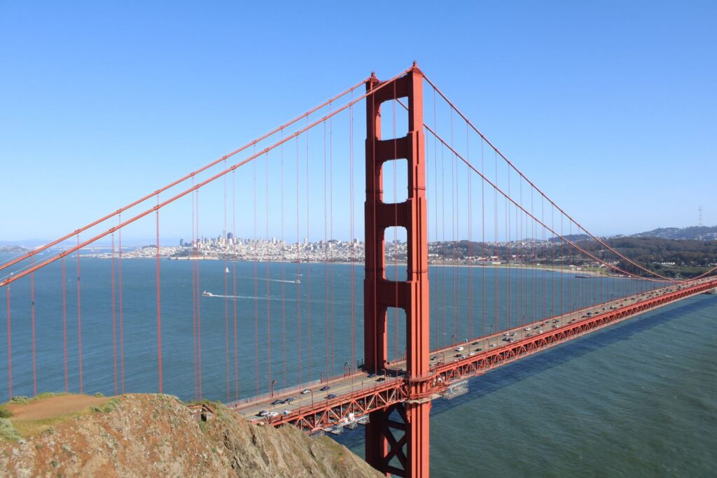 Stunning view of Golden Gate Bridge spanning San Francisco Bay under clear blue skies.