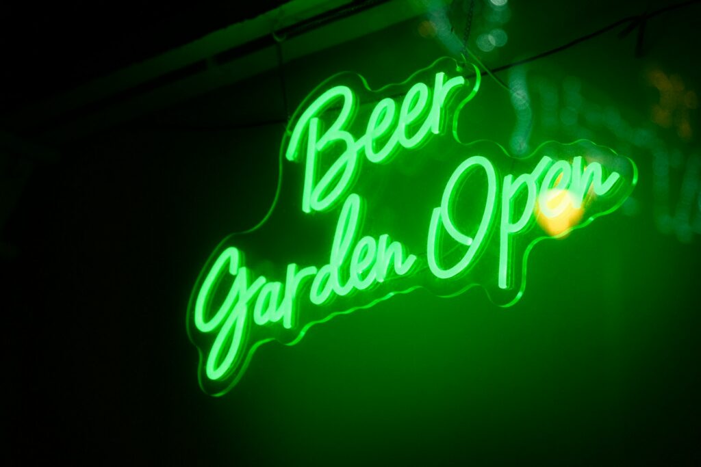 Green neon sign says
