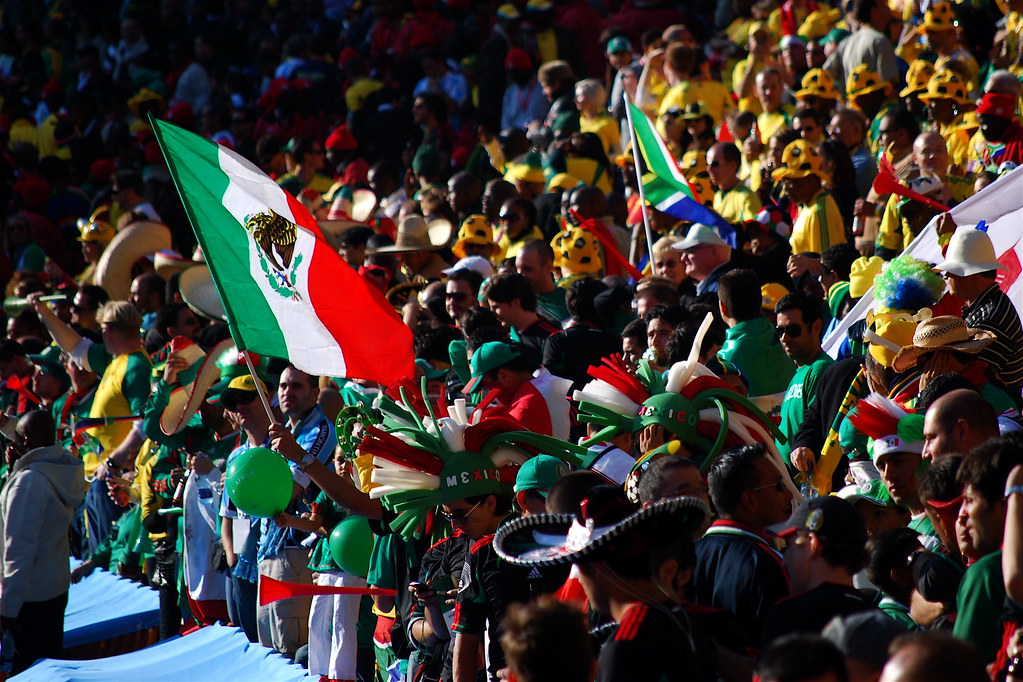 Mexico soccer fans celebrating with flags