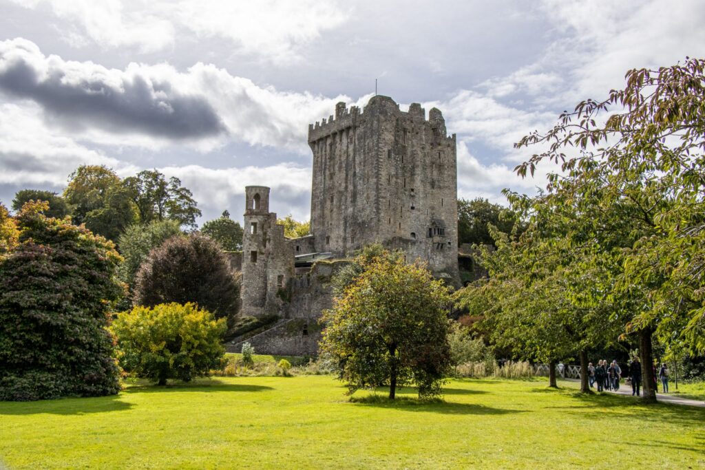 Blarney Castle surrounded by vibrant greenery in County Cork, Ireland.