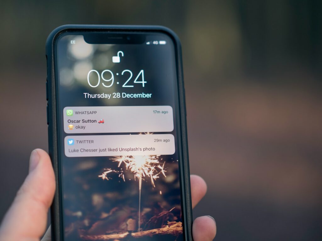 person holding phone with notifications