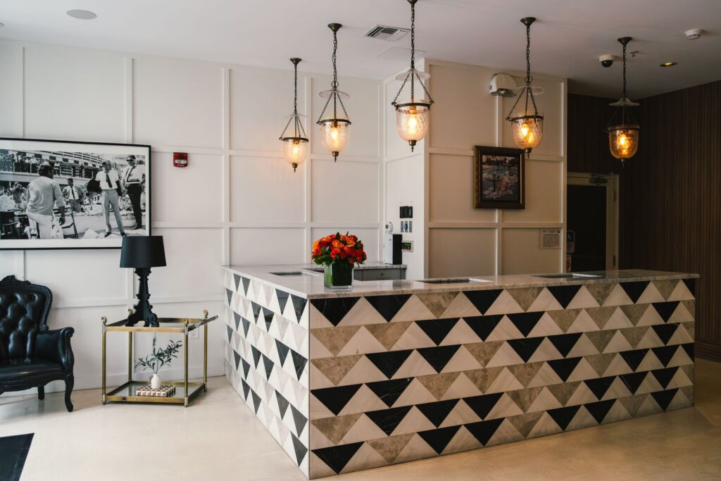 Explore the elegant reception area of a Miami Beach boutique hotel, showcasing modern coastal design and vibrant decor.