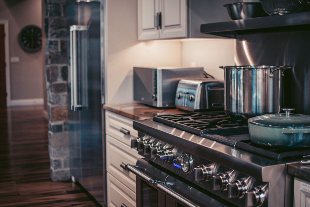 Stylish modern kitchen showcasing stainless steel appliances and elegant decor.