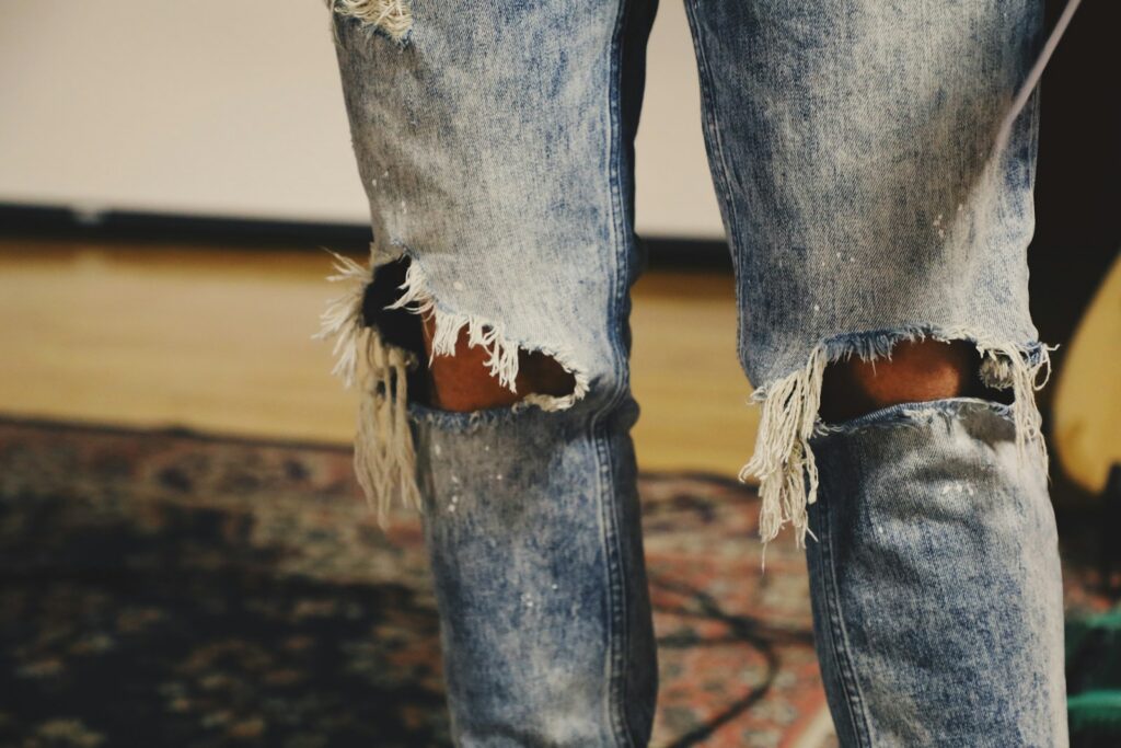 Person wearing an 80s-inspired acid wash denim