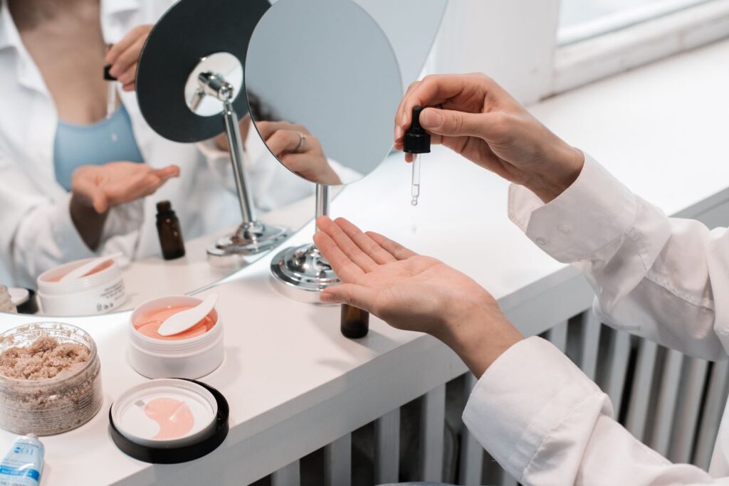 A detailed skincare routine featuring facial oils and creams in a modern, minimalist setting.