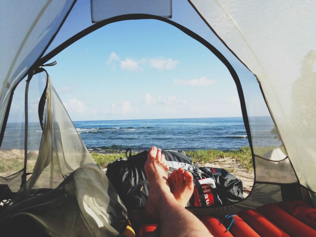 Experience the serenity of oceanview camping from the comfort of your tent.