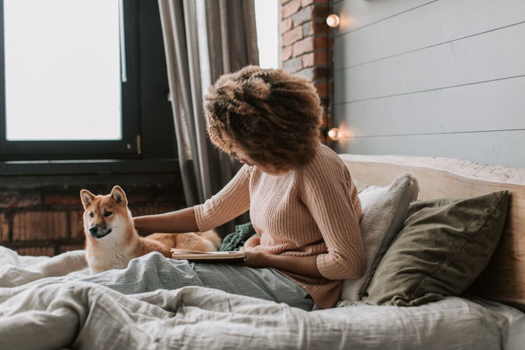 Gen Z single person looking content at home with dog