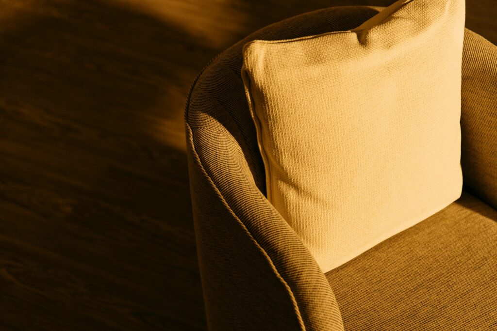 a close up of a cushion on a chair