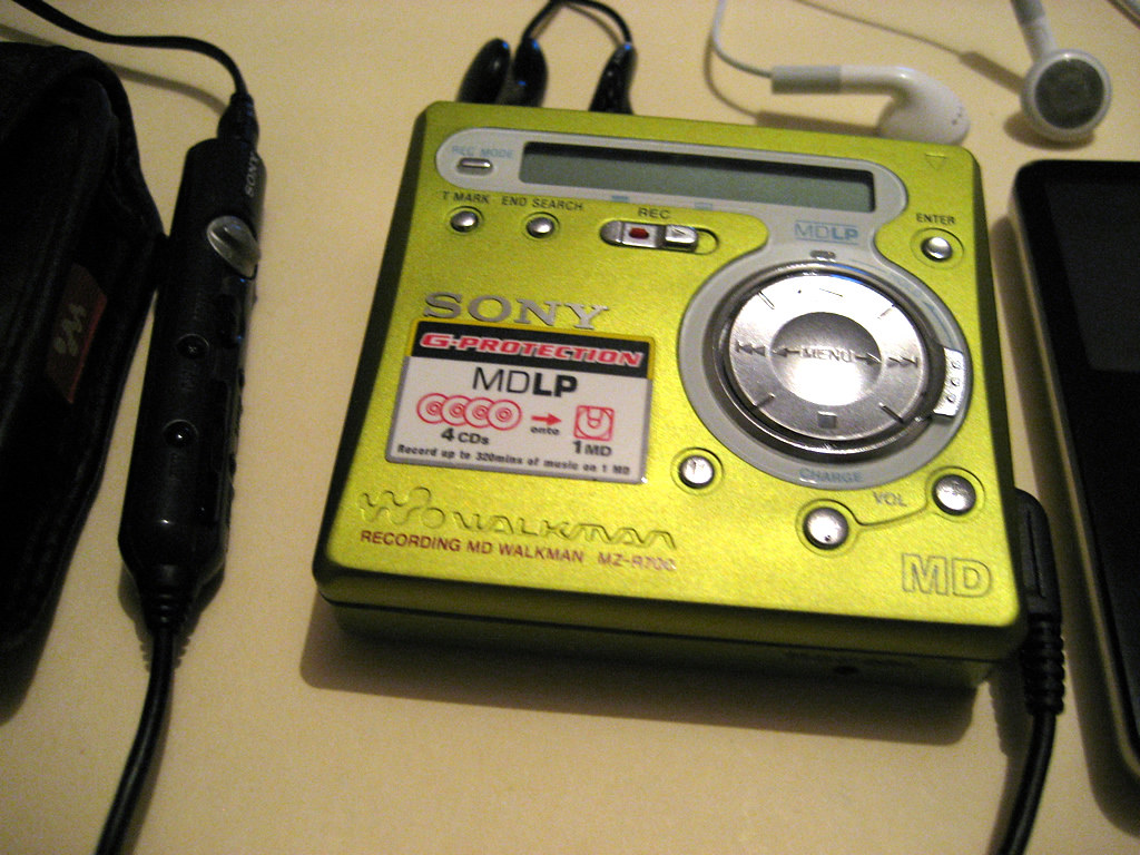 Sony minidisc player in neon green on a table