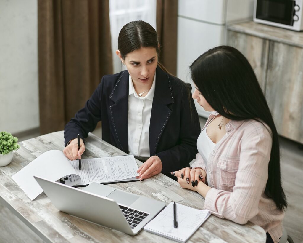 Employee discussing benefits paperwork with HR