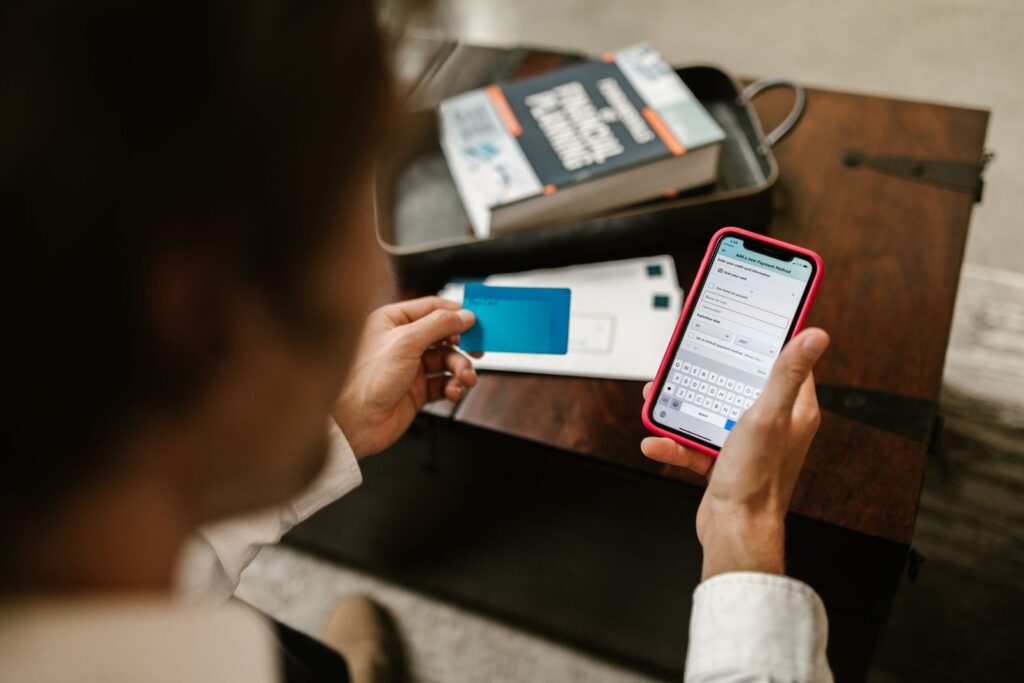 Person making an extra online payment using a smartphone for student loan