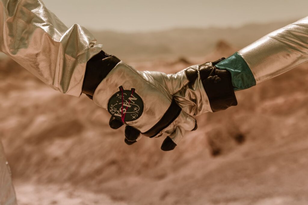 Astronaut with NASA gloves