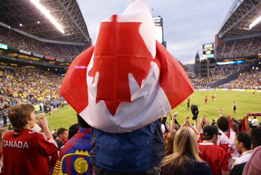 Canadian soccer fans with massive Canadian flag