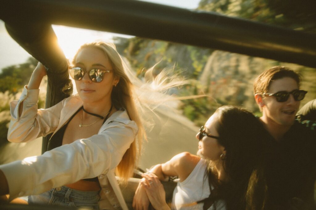 teens cruising around town in a car 
