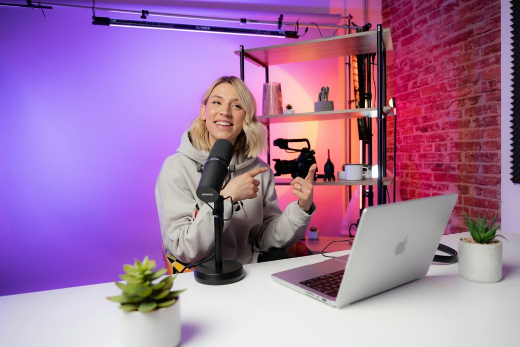 a woman sitting in front of a laptop computer
