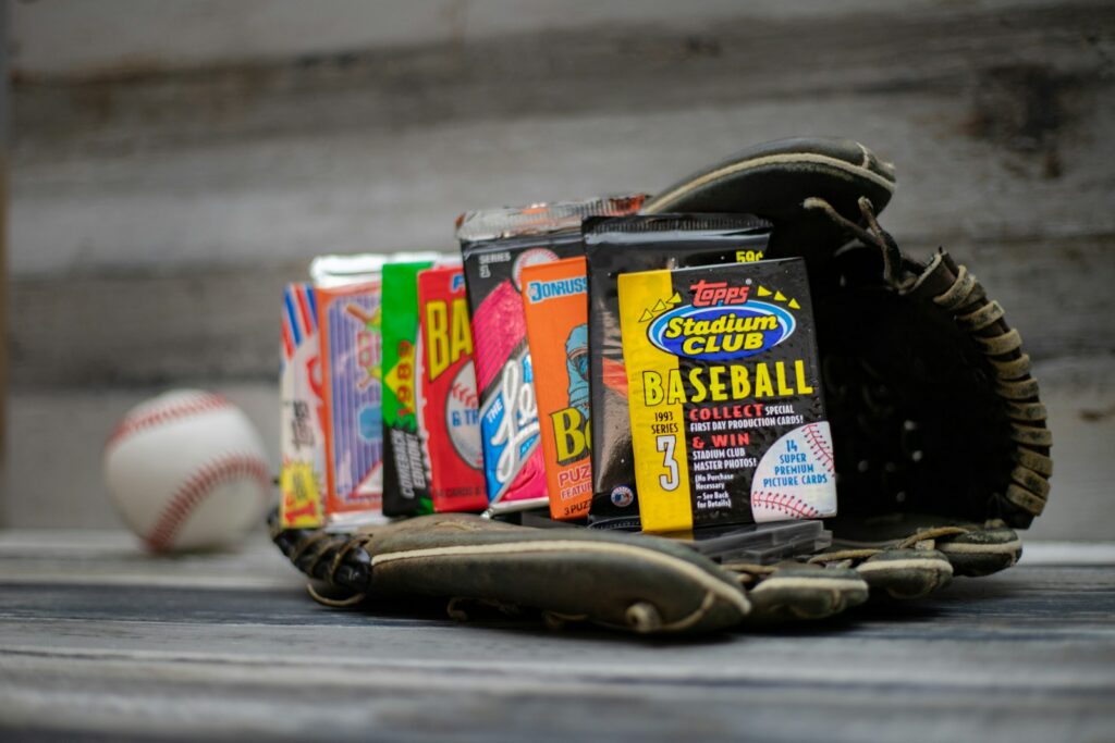 a baseball glove and some baseballs on a table