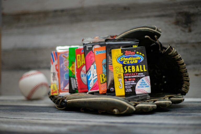 a baseball glove and some baseballs on a table
