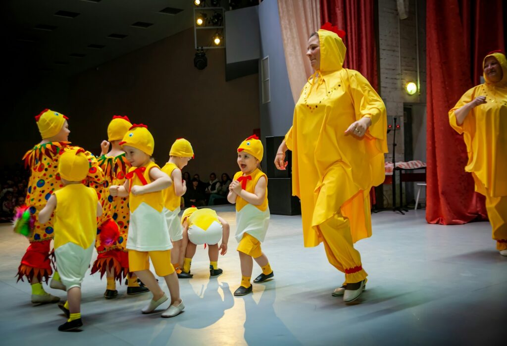 a person in a garment surrounded by children