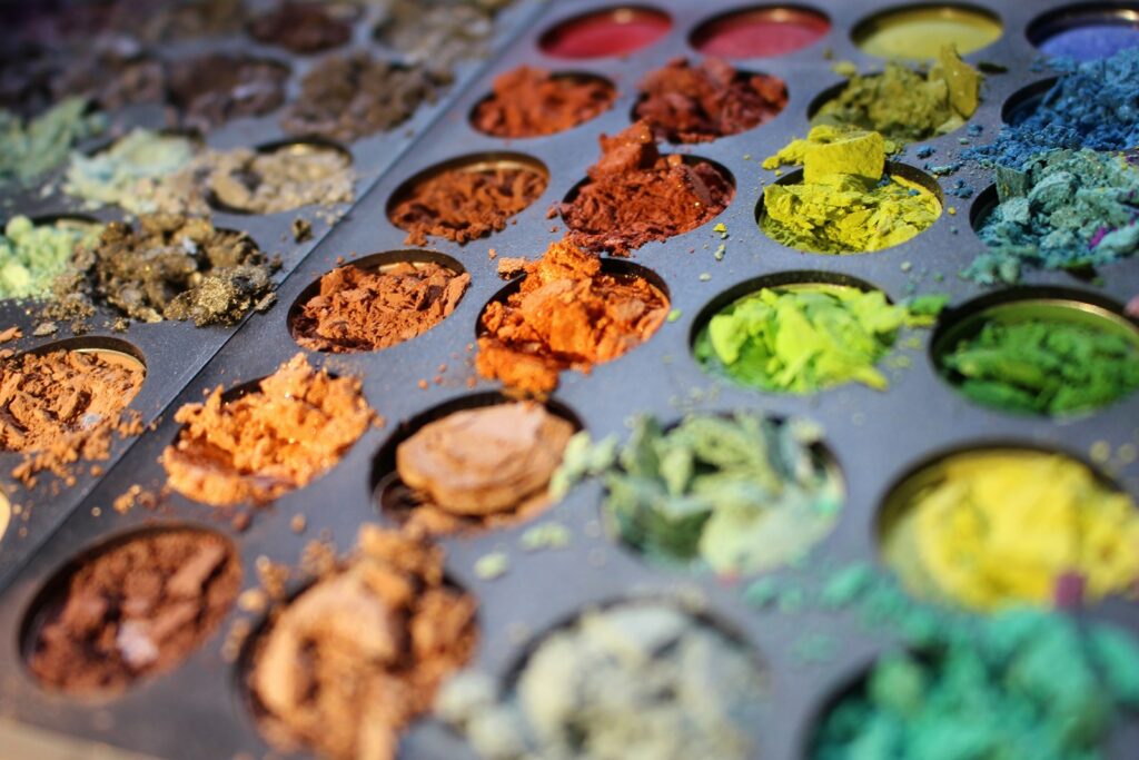 a tray filled with lots of different colored powders