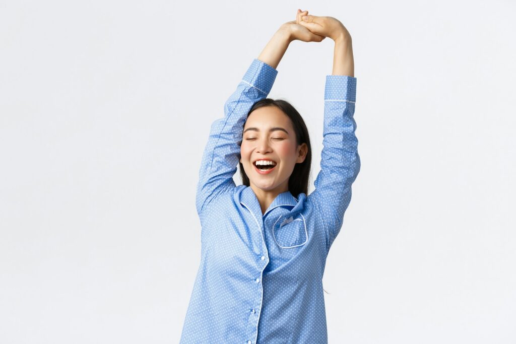 a woman with her arms in the air