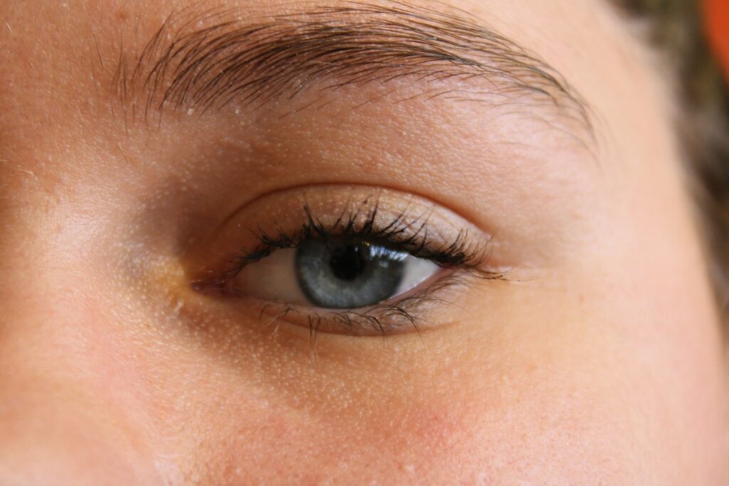 A single blue eye and eyebrow.