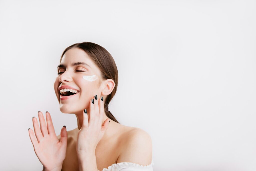 Woman applying sunscreen for oily skin