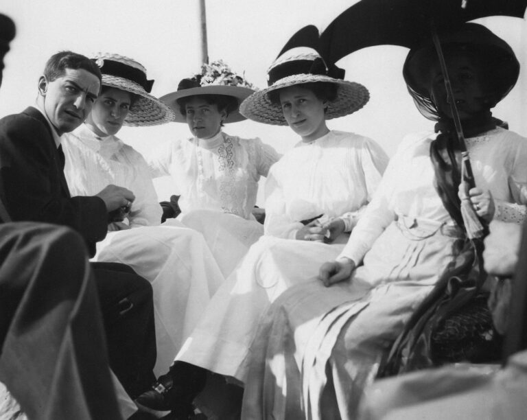 Group of people in hats on a boat