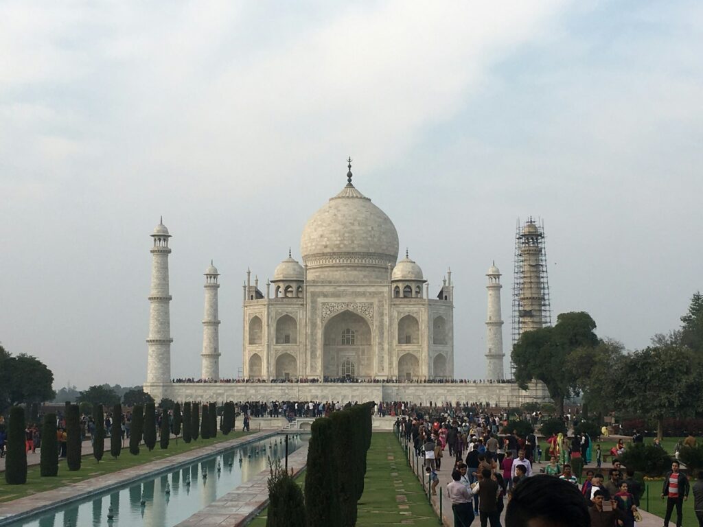 a group of people standing in front of a white building