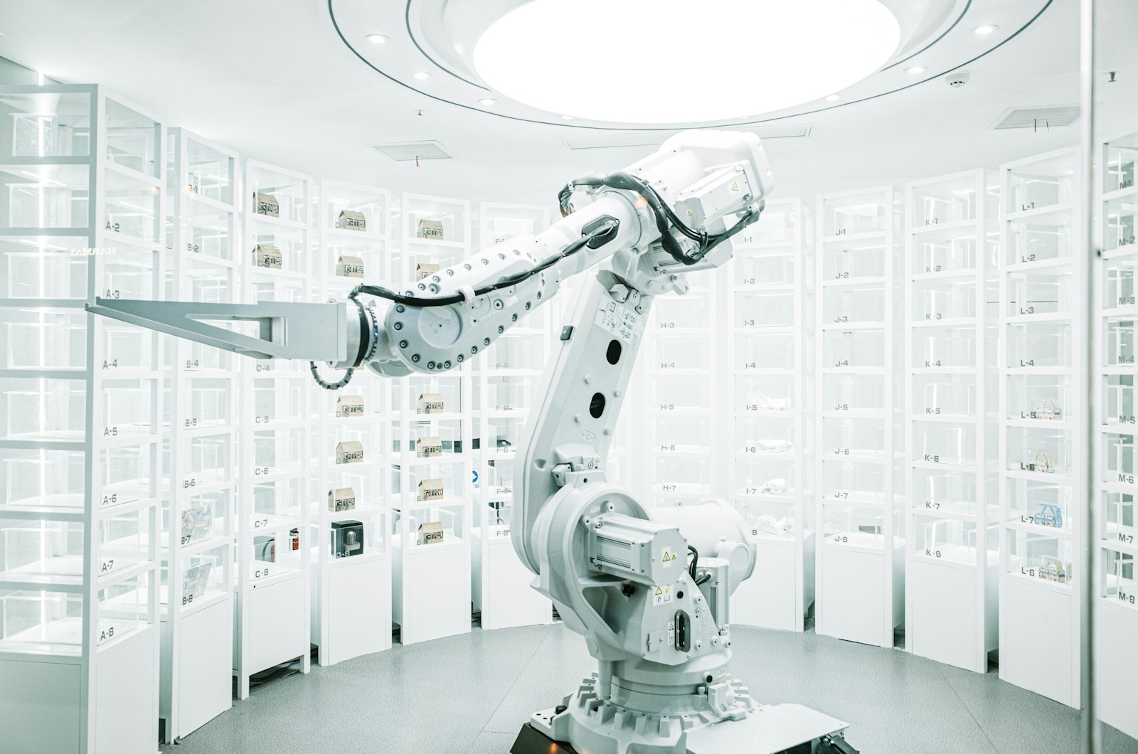 white robotic arm in display showroom