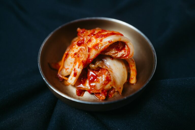 a metal bowl filled with sliced up food