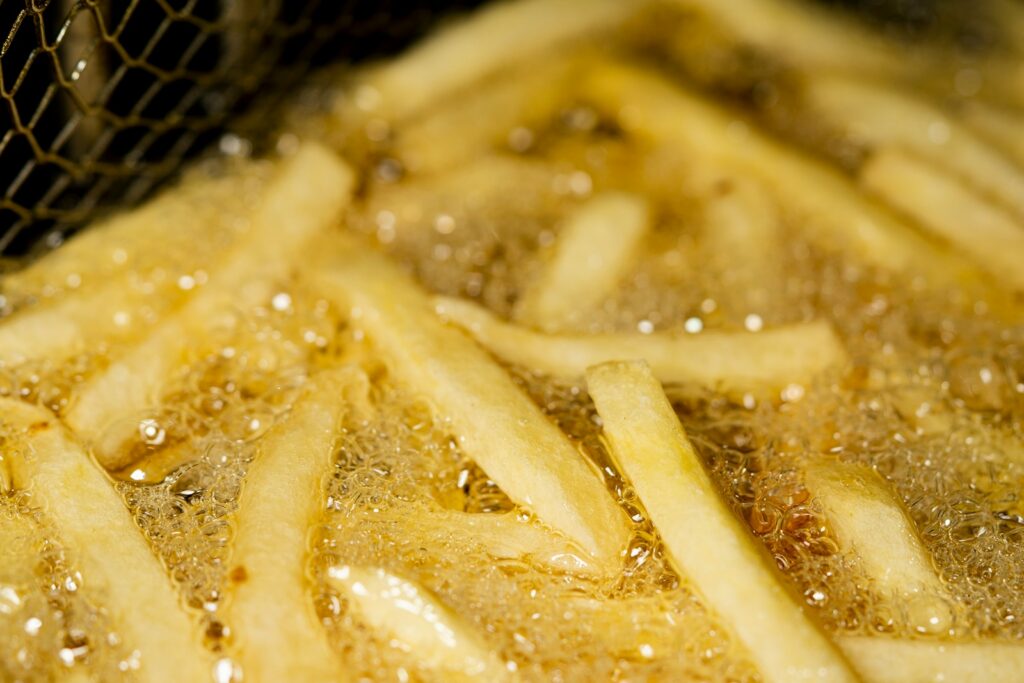 Cooking fries in artificial trans fats