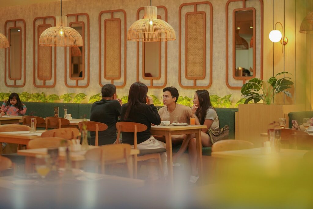 People dining at tables in a modern cafe