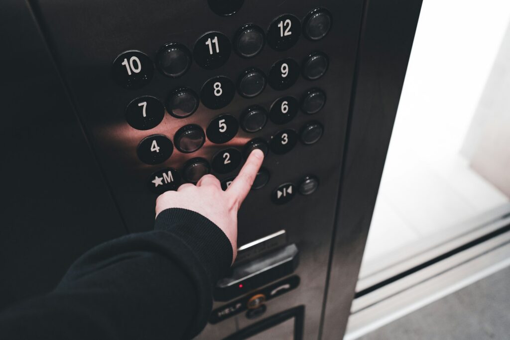 a person pressing a button on a machine