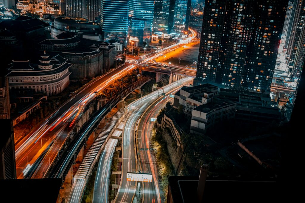a view of a city at night from the top of a building