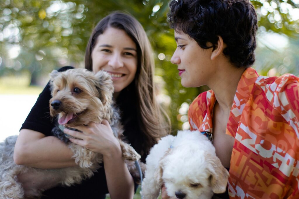 couple with dogs at park