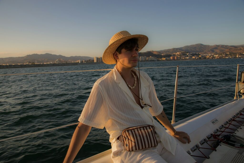 A woman in a hat is sitting on a boat