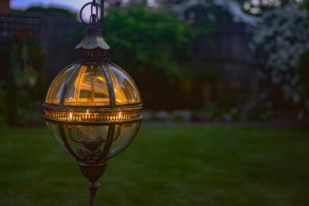 a light that is on a pole in the grass