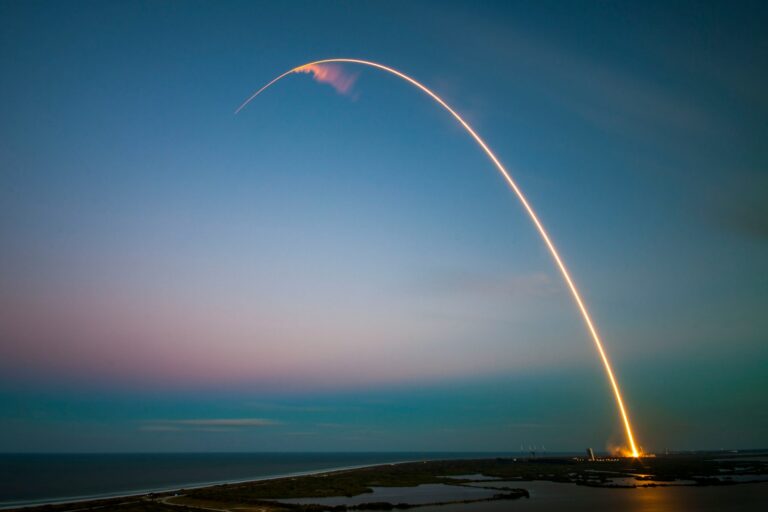 rocket launch light trail at dusk