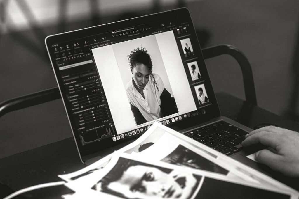 Someone edits a photo on a laptop.
