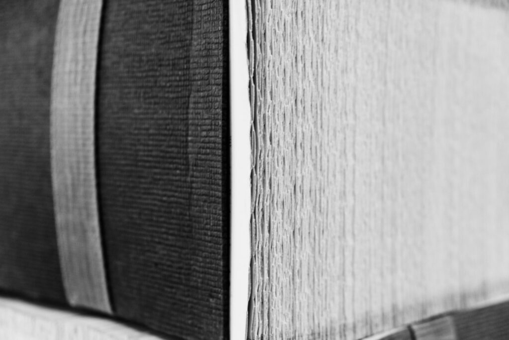 a black and white photo of a closed book