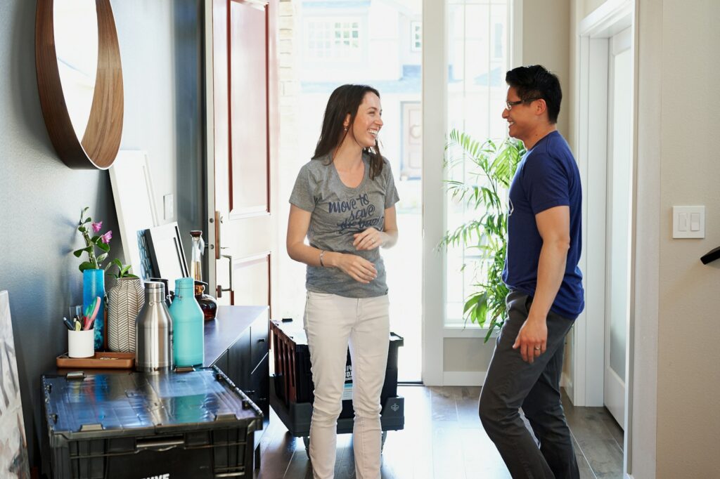 man in blue crew neck t-shirt and woman in gray t-shirt