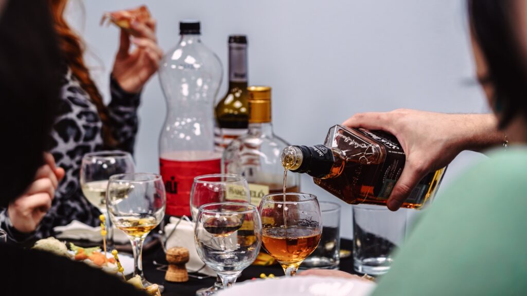 A group of people sitting around a table with wine glasses