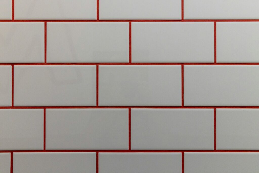 a close up of a white and red brick wall