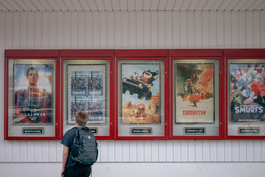 A person looks at movie posters.