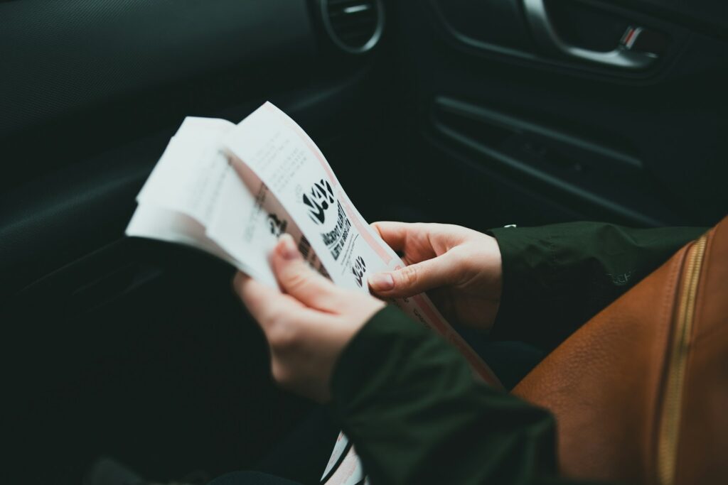 person holding white printer paper