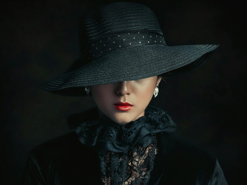 a woman wearing a black hat and scarf