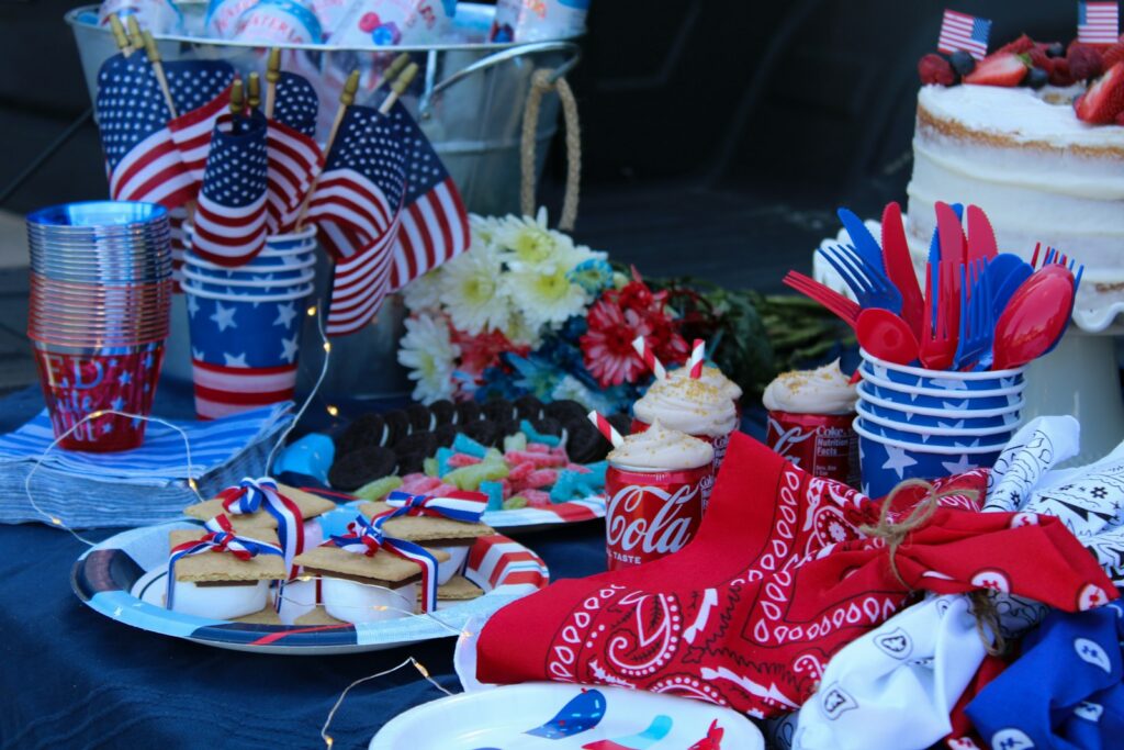 a table with food, flags, and red, white, and blue decor