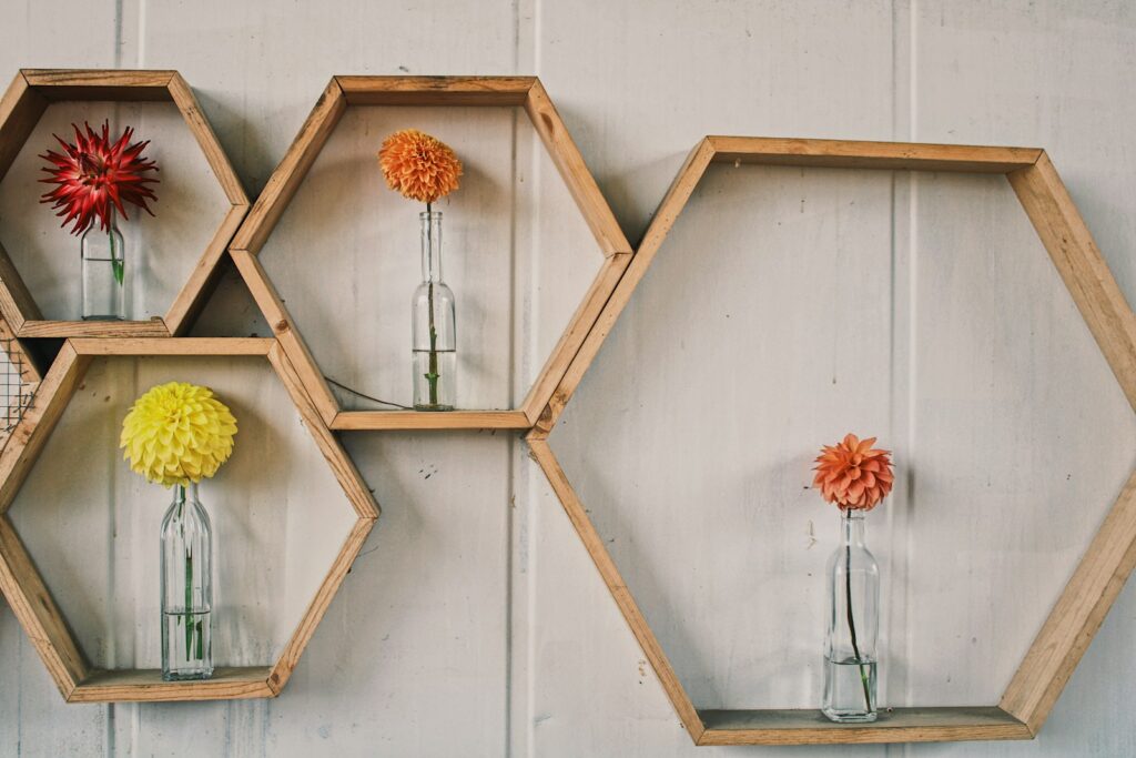 orange and yellow flowers on white wooden wall